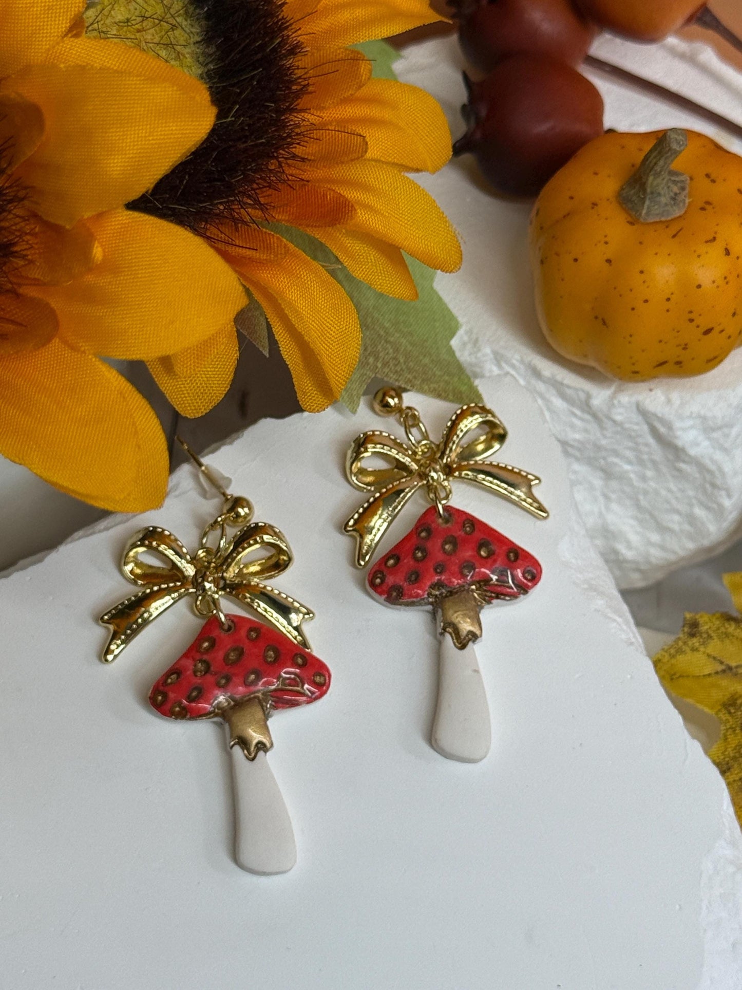 Mushroom Earrings, Whimsical Earrings — Red Toadstool Dangles with Gold Bows | Clay & Resin Fall Jewelry