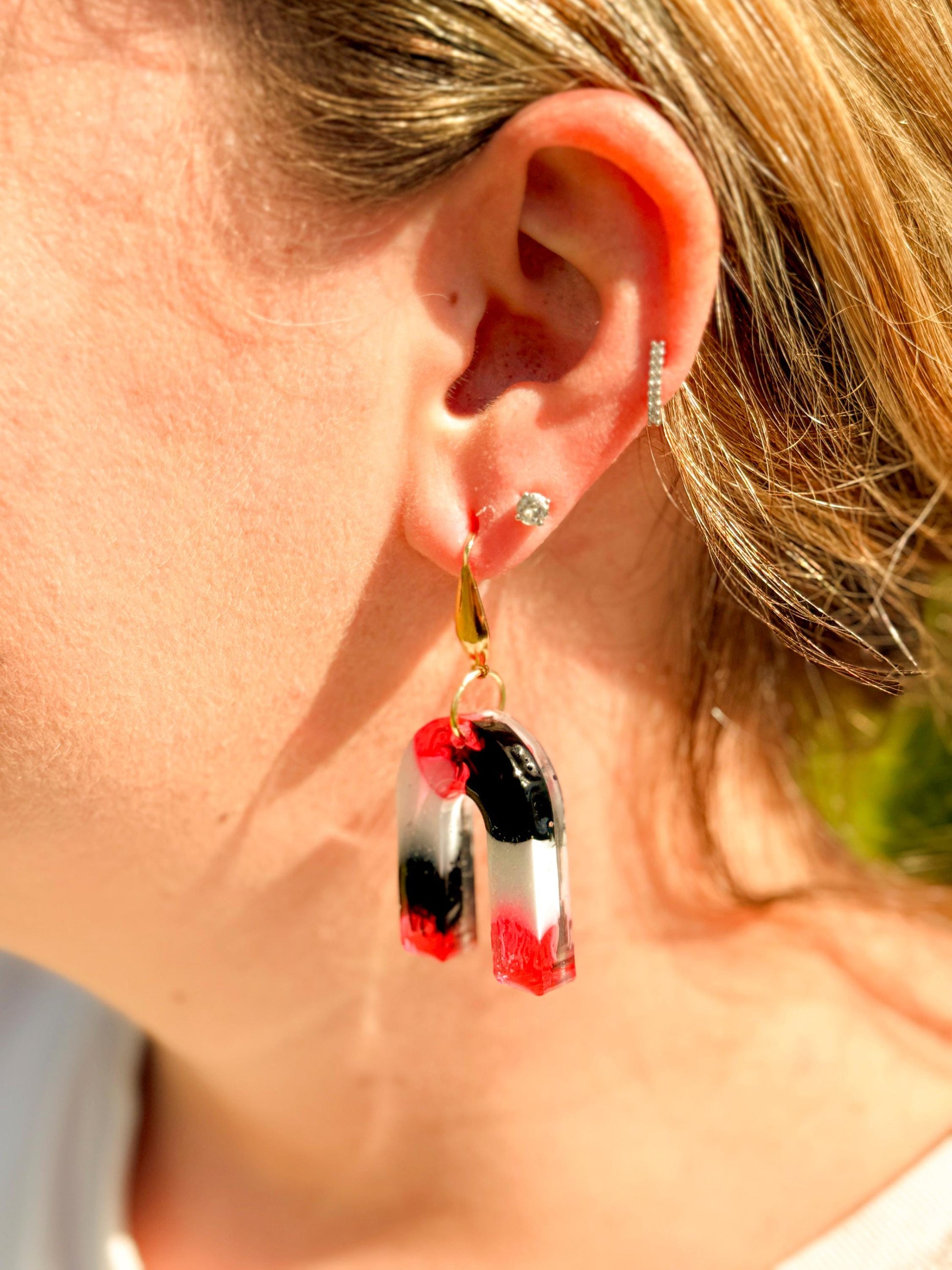 Handcrafted Resin Arch Earrings: Pink Black Swirl with Gold Hooks