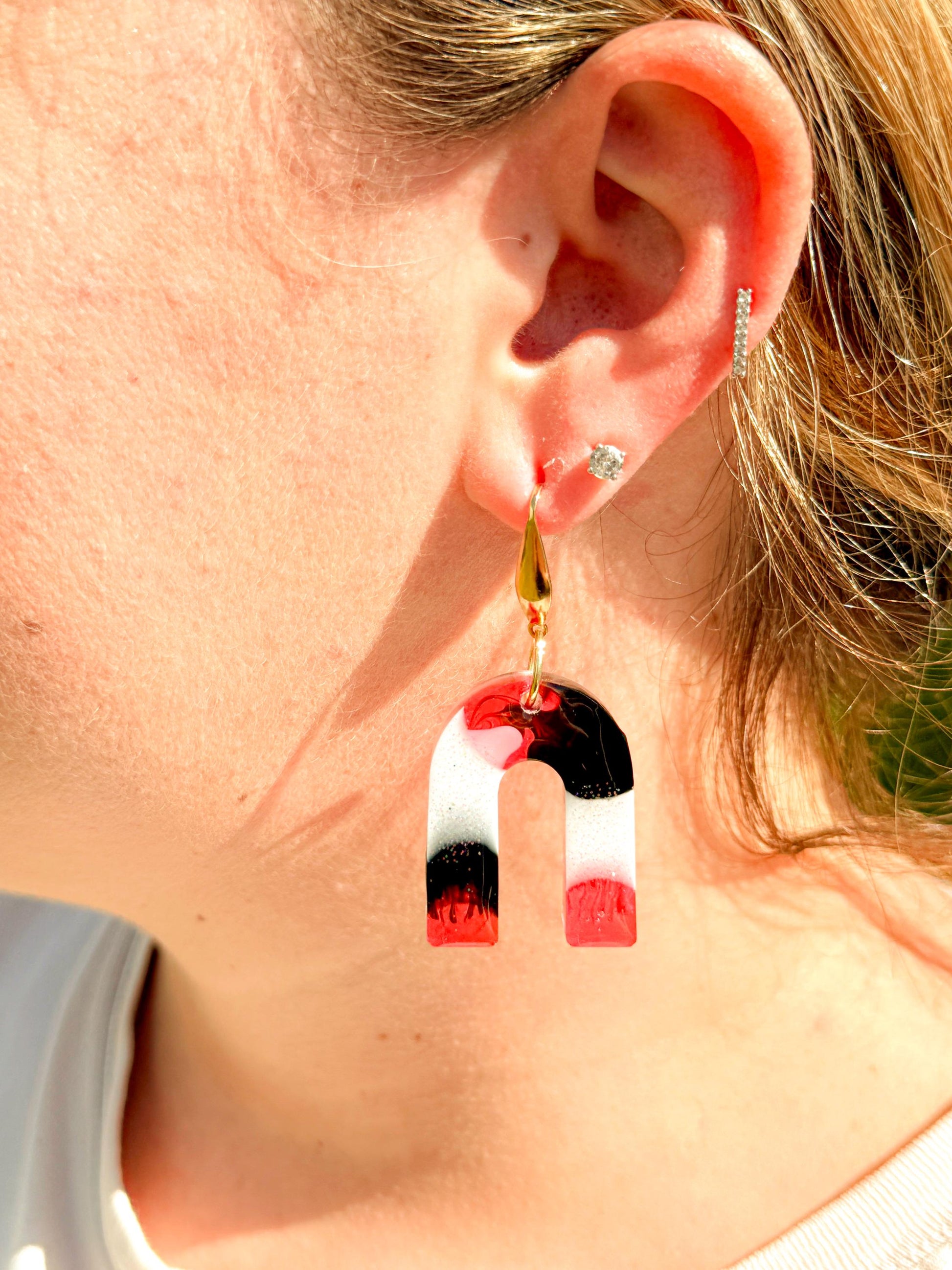 Handcrafted Resin Arch Earrings: Pink Black Swirl with Gold Hooks